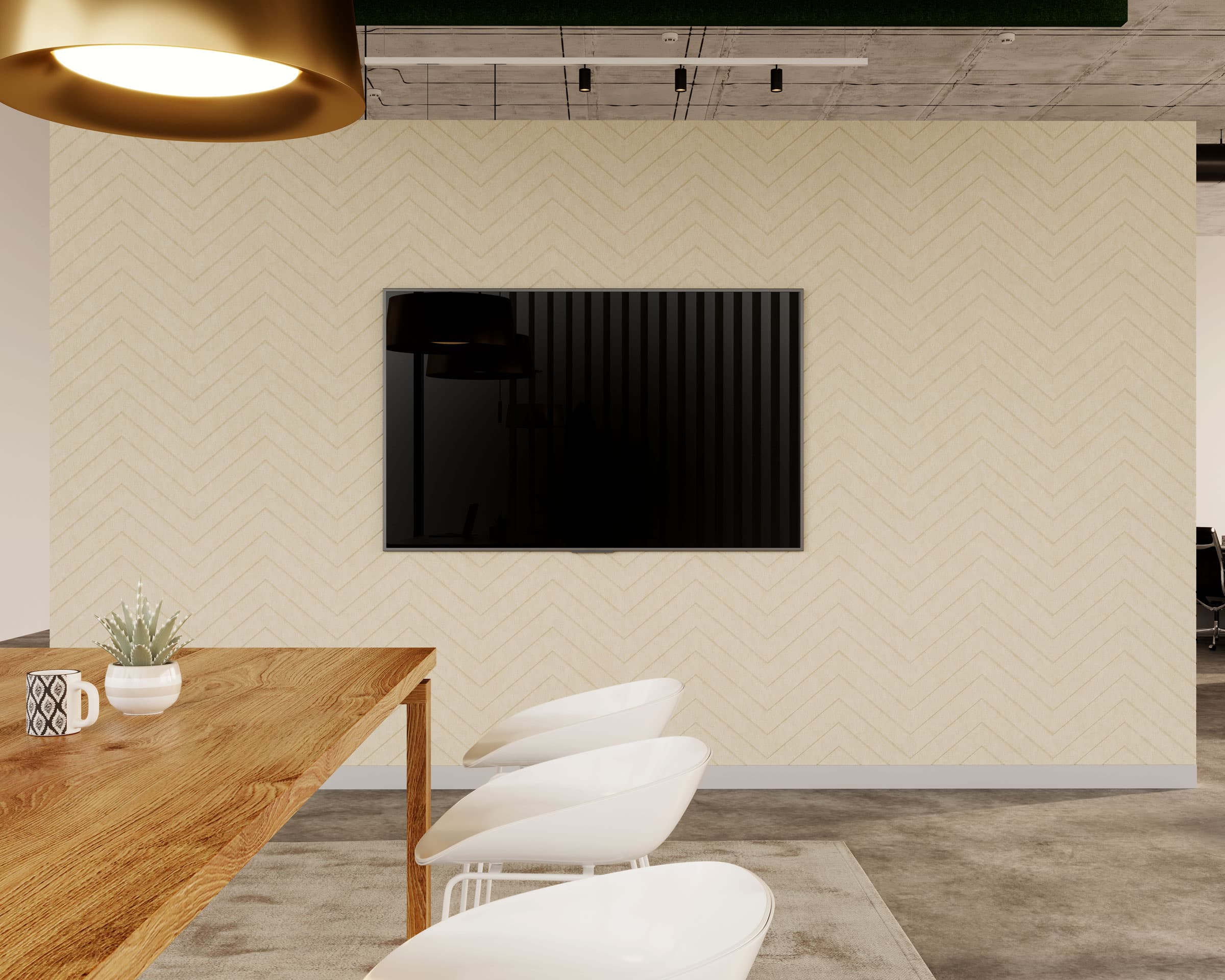 A modern office interior features a wooden table with white chairs, a large gold ceiling light, and a TV mounted on chevron acoustic felt wall panels. The ceiling has an exposed concrete finish, and a potted plant sits on the wooden table.