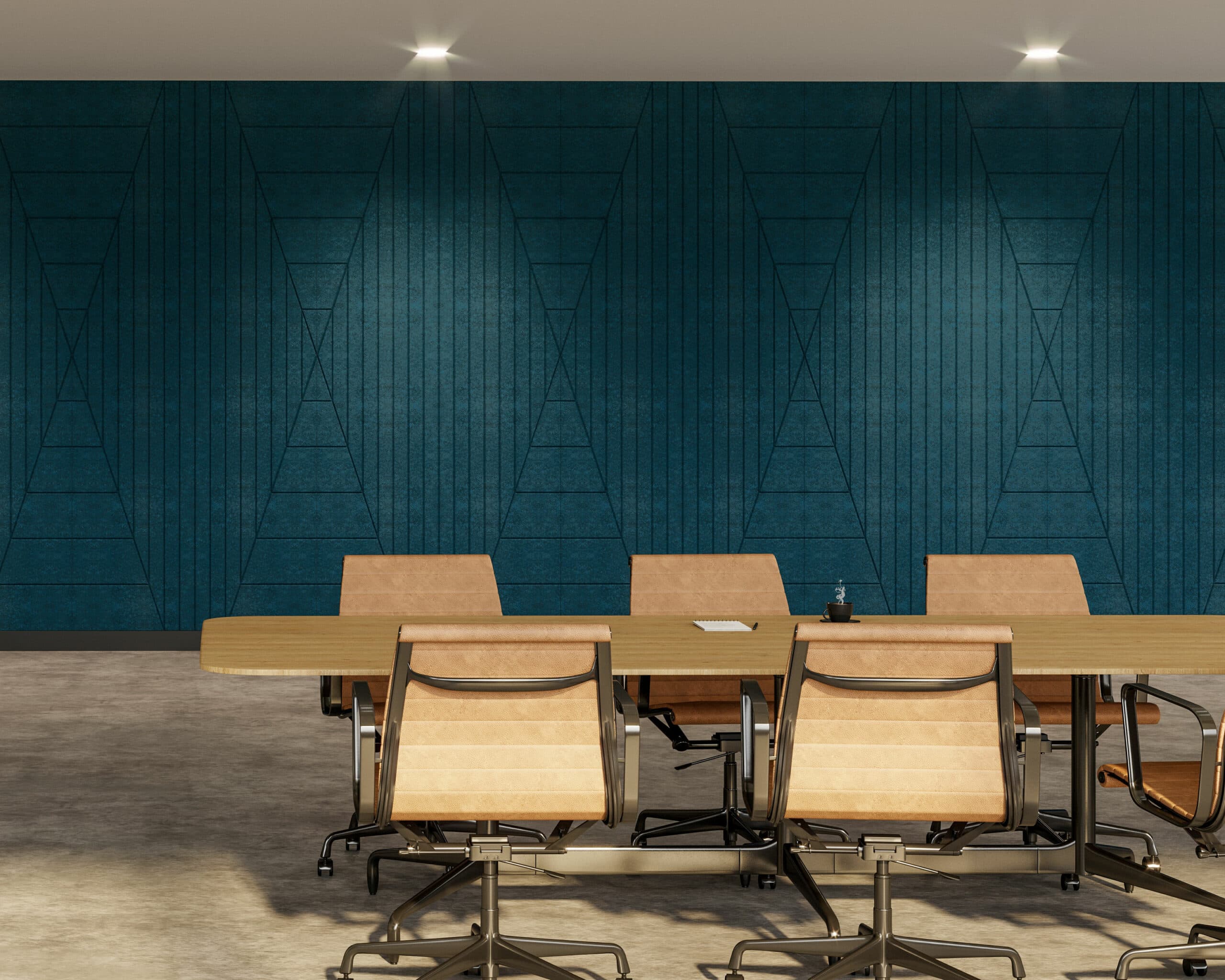 A modern conference room features a long wooden table surrounded by beige office chairs on a polished concrete floor. The dark teal accent wall, enhanced with geometric patterns and acoustic felt wall panels, adds both style and sound control. The room is illuminated by recessed ceiling lights.