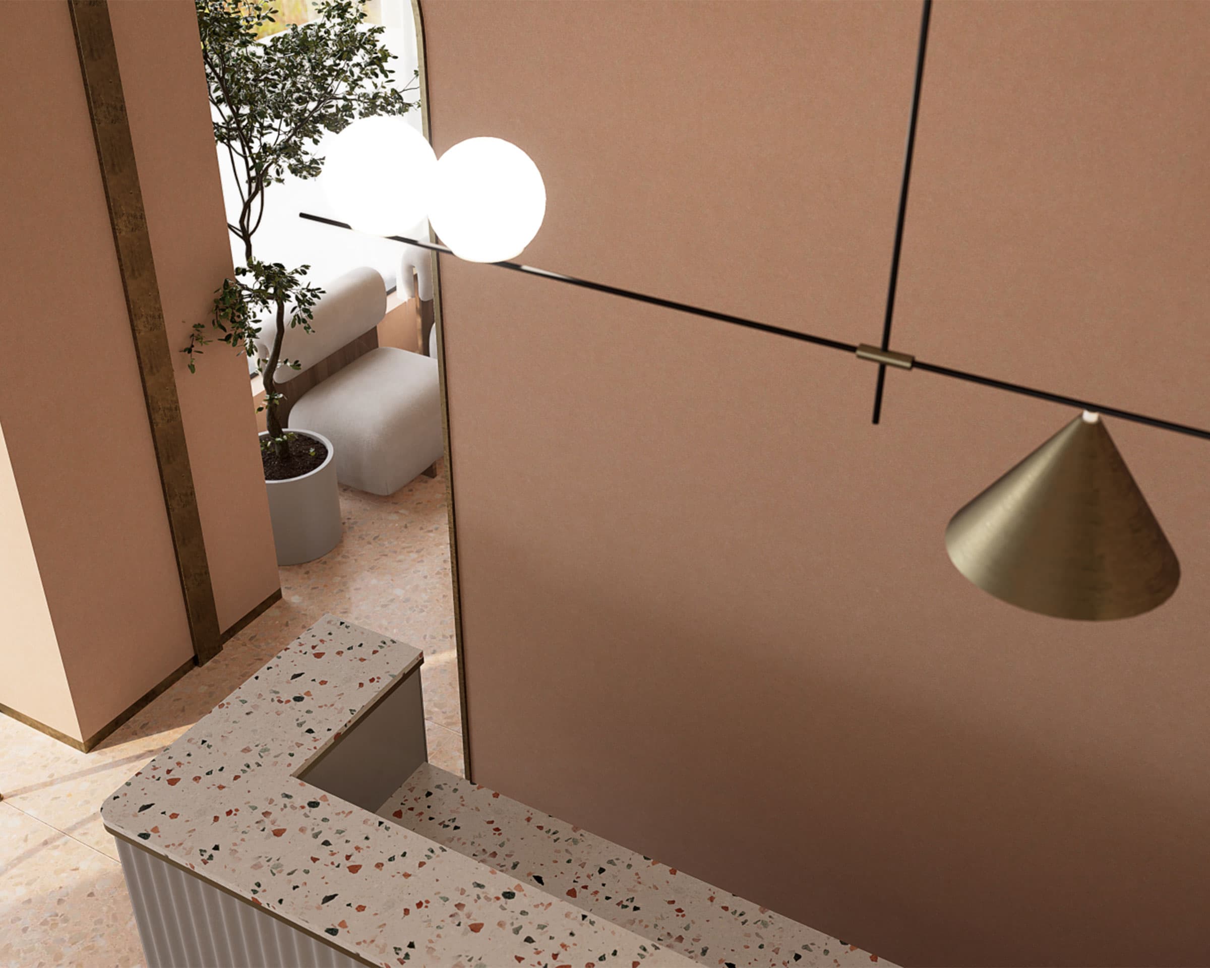 A modern interior featuring a terrazzo countertop, a lounge area with two grey seats, a potted plant, and contemporary lighting fixtures. Acoustic felt wall panels add texture while a brass cone-shaped pendant light and a rod with glowing spheres hang above.