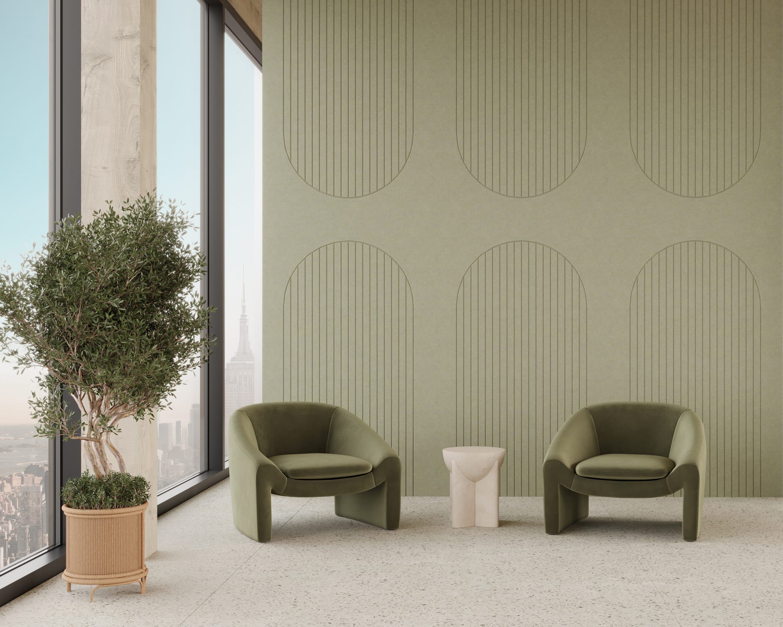 A modern, minimalist room with two green armchairs and a small round table between them, set against a textured olive-green wall adorned with arch acoustic felt wall panels. A potted plant stands by the large windows, offering a view of a cityscape outside.