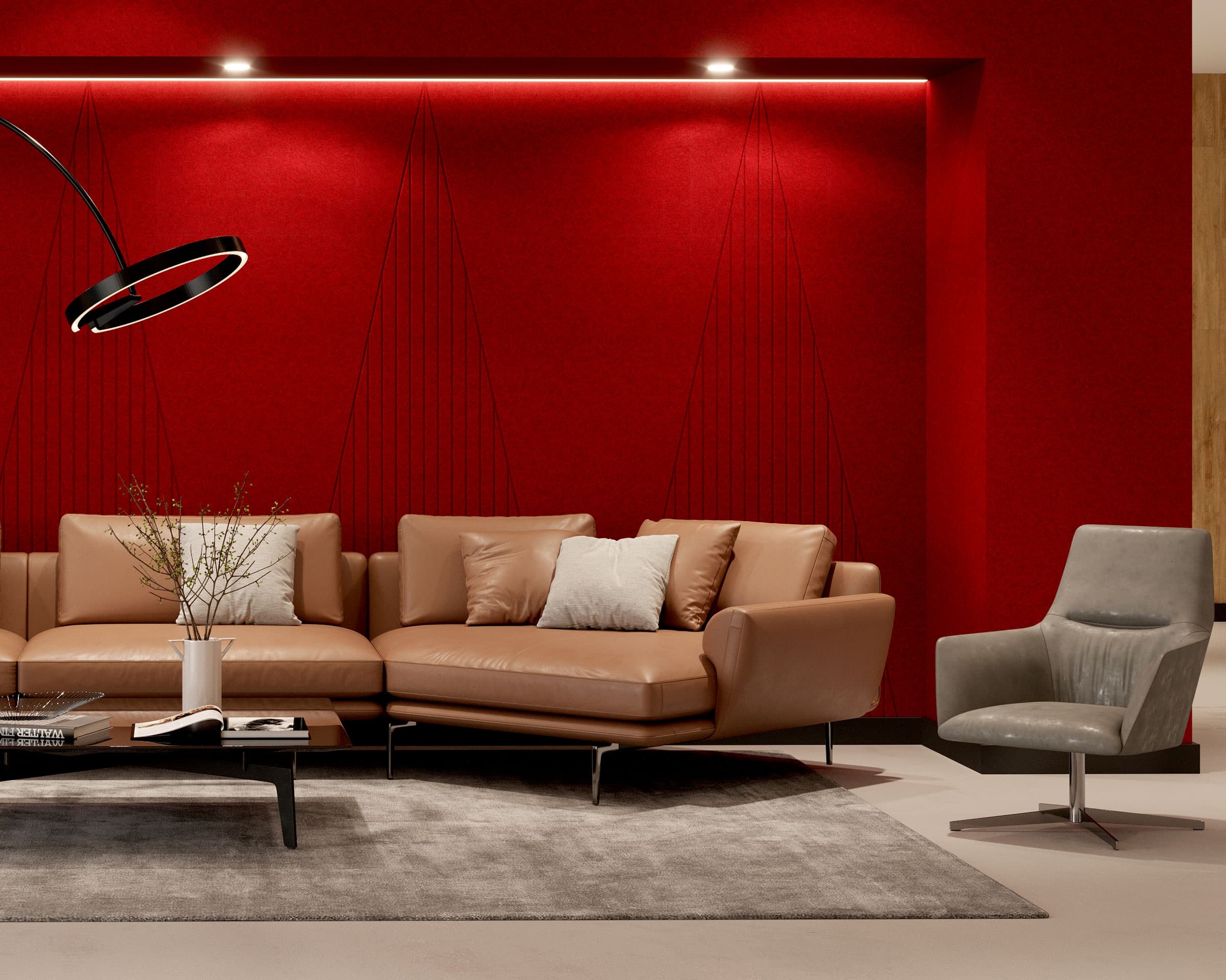 A modern living room with a red acoustic felt wall panels, a beige sectional sofa with white pillows, a black circular hanging light, a small black coffee table with decor, a gray carpet, and a gray armchair. The ambiance is cozy and stylish.