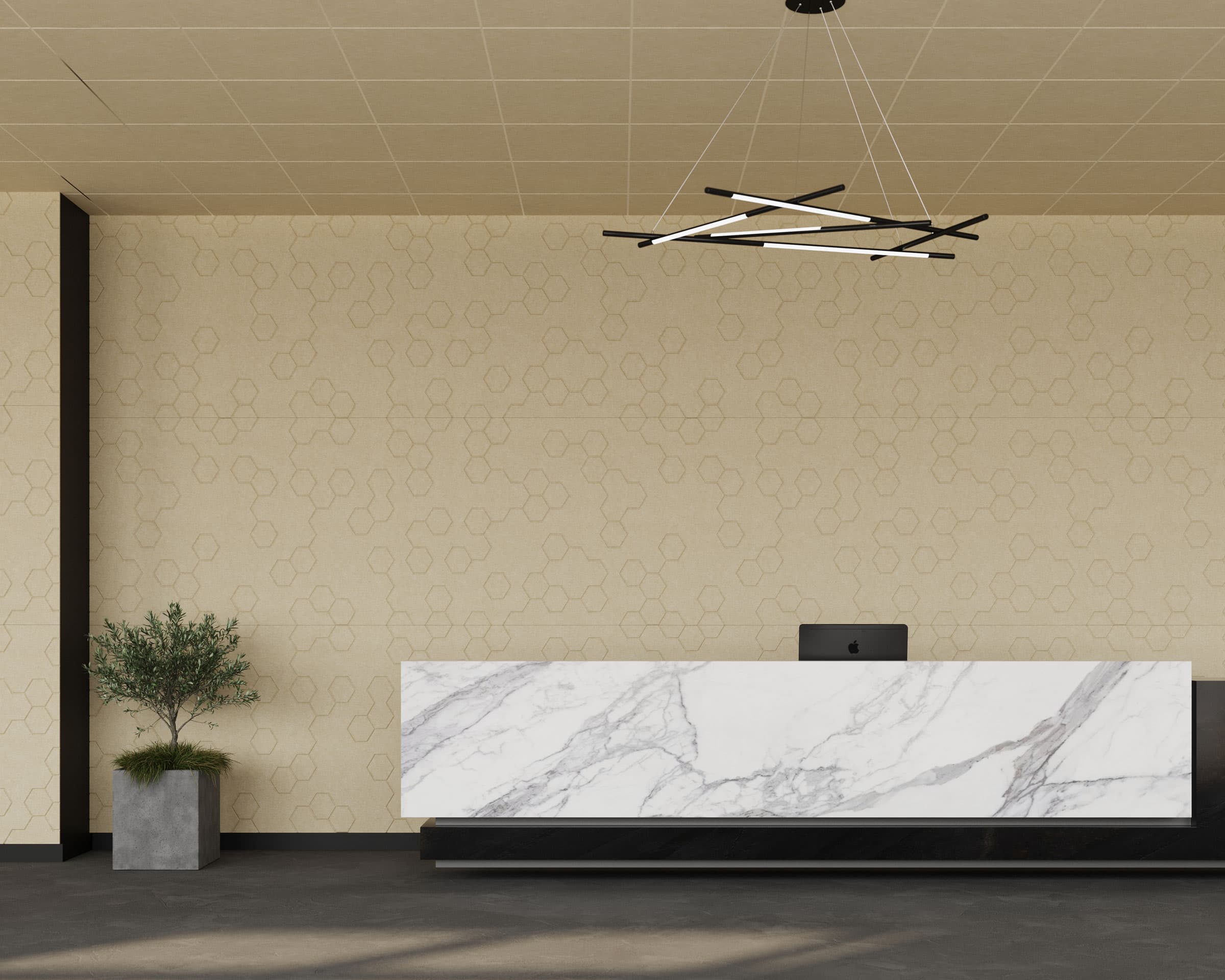 A modern office reception area features a marble front desk with a sleek black base. An abstract black and white ceiling light fixture hangs above. The beige walls, adorned with acoustic felt wall panels, have a subtle patterned design, and a potted plant sits to the side of the desk on the dark floor.