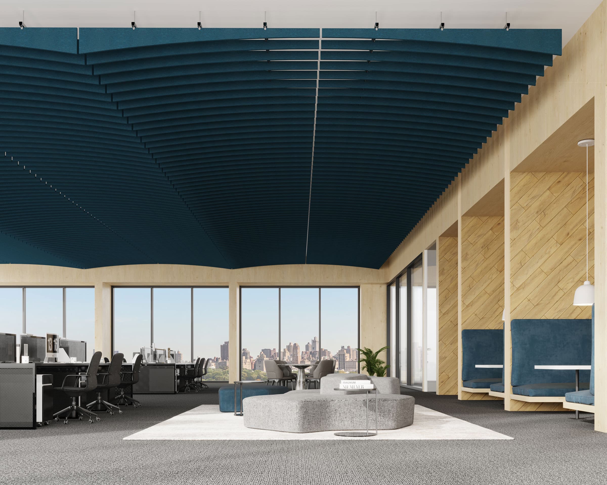 A modern office space with large windows offering a city view. The room features unique blue ribbed acoustic ceiling baffles enhanced by arc acoustic ceiling baffles, gray carpet, and light wood accents. The workspace includes desks with chairs on the left and cozy blue booth seating on the right.