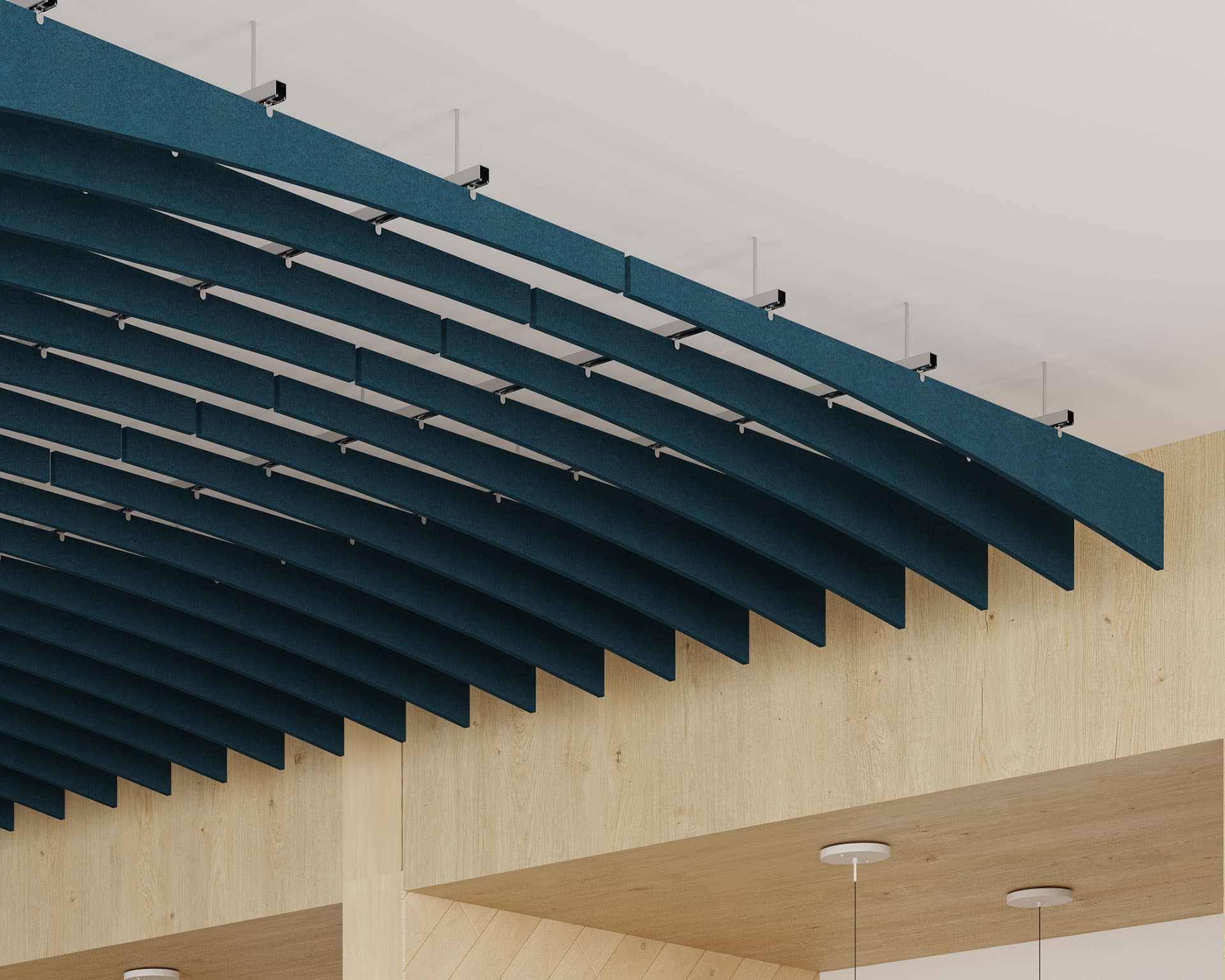 A modern ceiling design featuring a series of parallel, blue, wave-like acoustic ceiling baffles suspended horizontally. The panels are mounted under a light-colored wooden structure, with hanging light fixtures partially visible below. The ceiling boasts a minimalist and contemporary aesthetic.