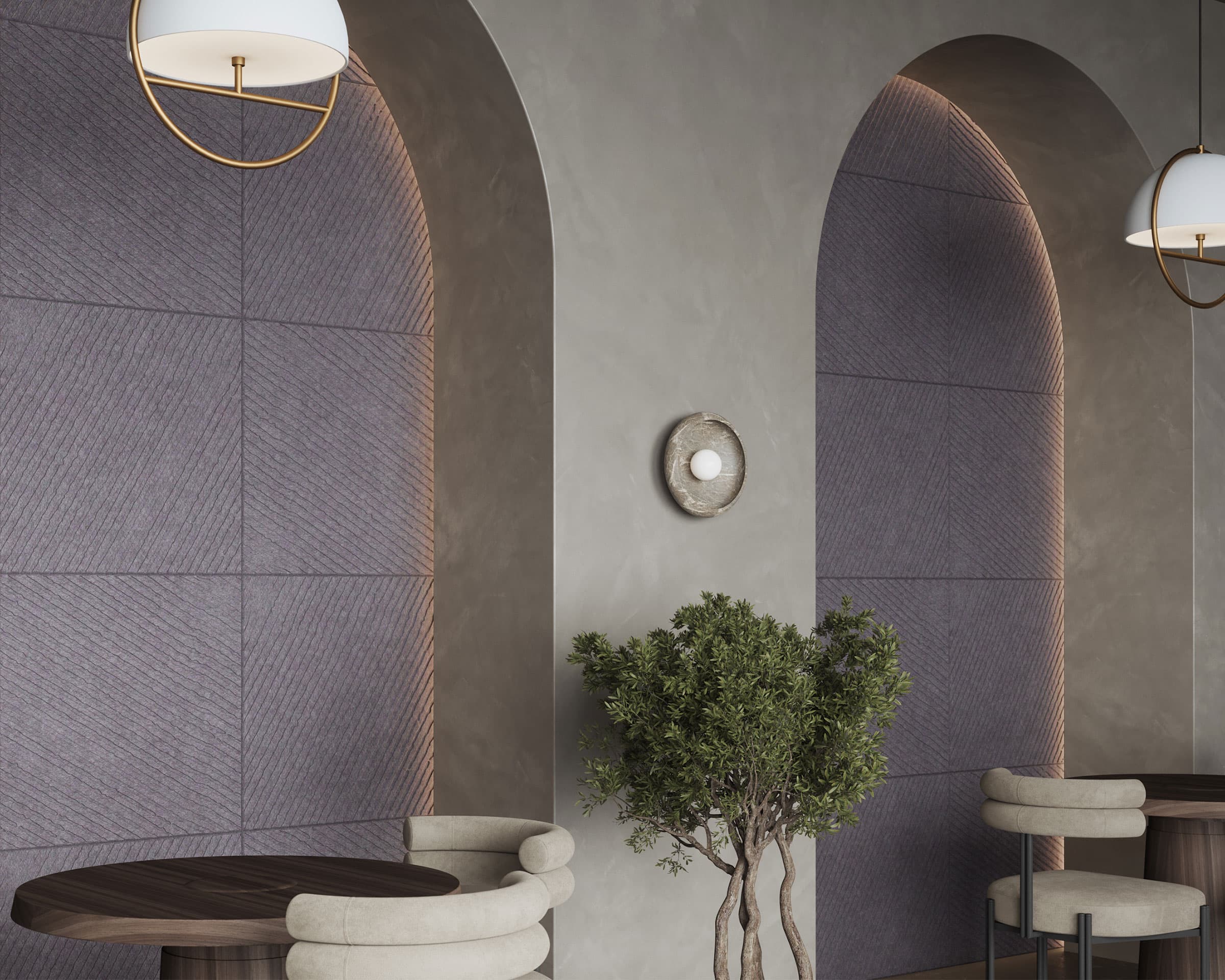 A contemporary interior features arched wall niches with textured acoustic felt wall tiles and soft lighting. Two round pendant lights hang from the ceiling, casting a warm glow. A small round table with cushioned chairs sits near a potted tree.