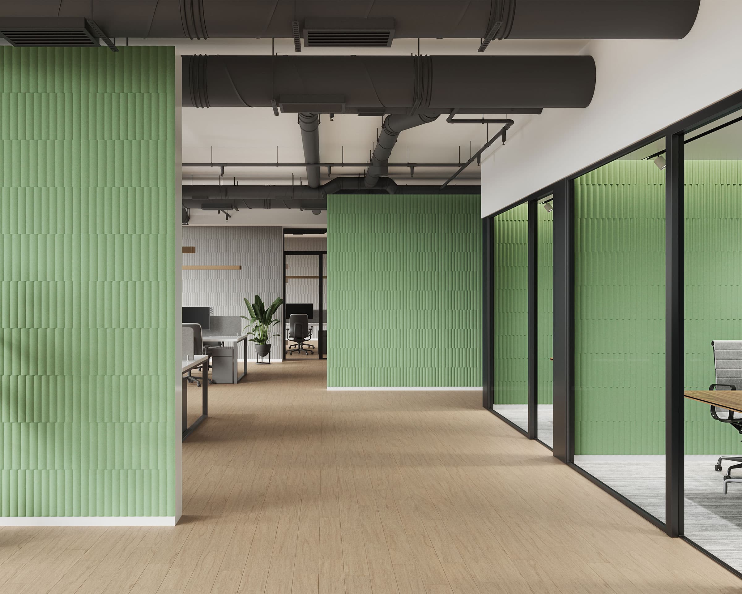 Modern office interior featuring green textured acoustic felt wall tiles, wooden flooring, and glass room dividers. The workspace includes office furniture such as desks, chairs, and computers. Industrial-style exposed ductwork is visible on the ceiling.