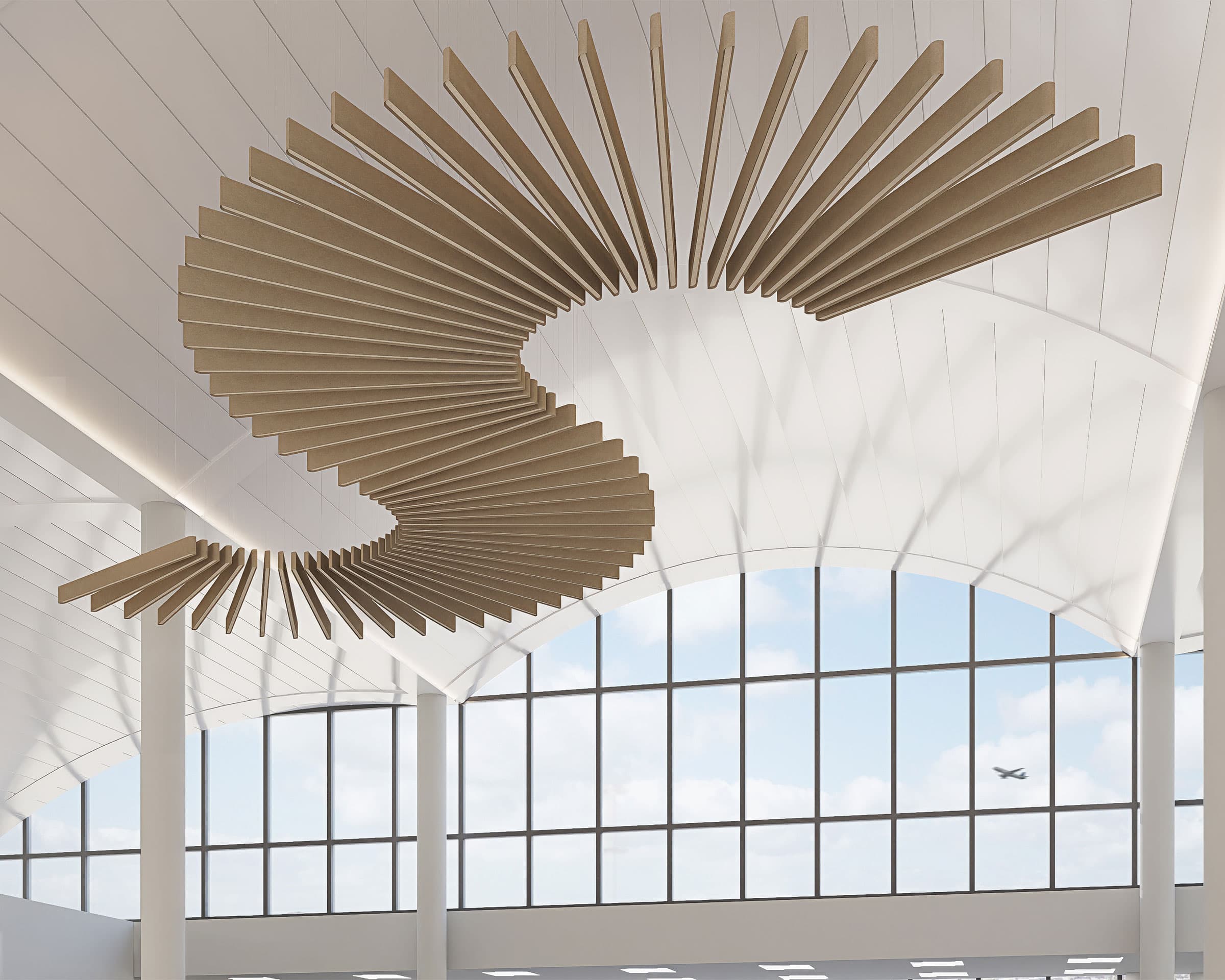 The image shows a modern indoor space with large windows and high ceilings. Suspended from the white ceiling are artistic, spiraling wooden sway acoustic ceiling baffles forming an "S" shape. Outside the windows, blue sky and clouds are visible, along with a small airplane mid-flight.