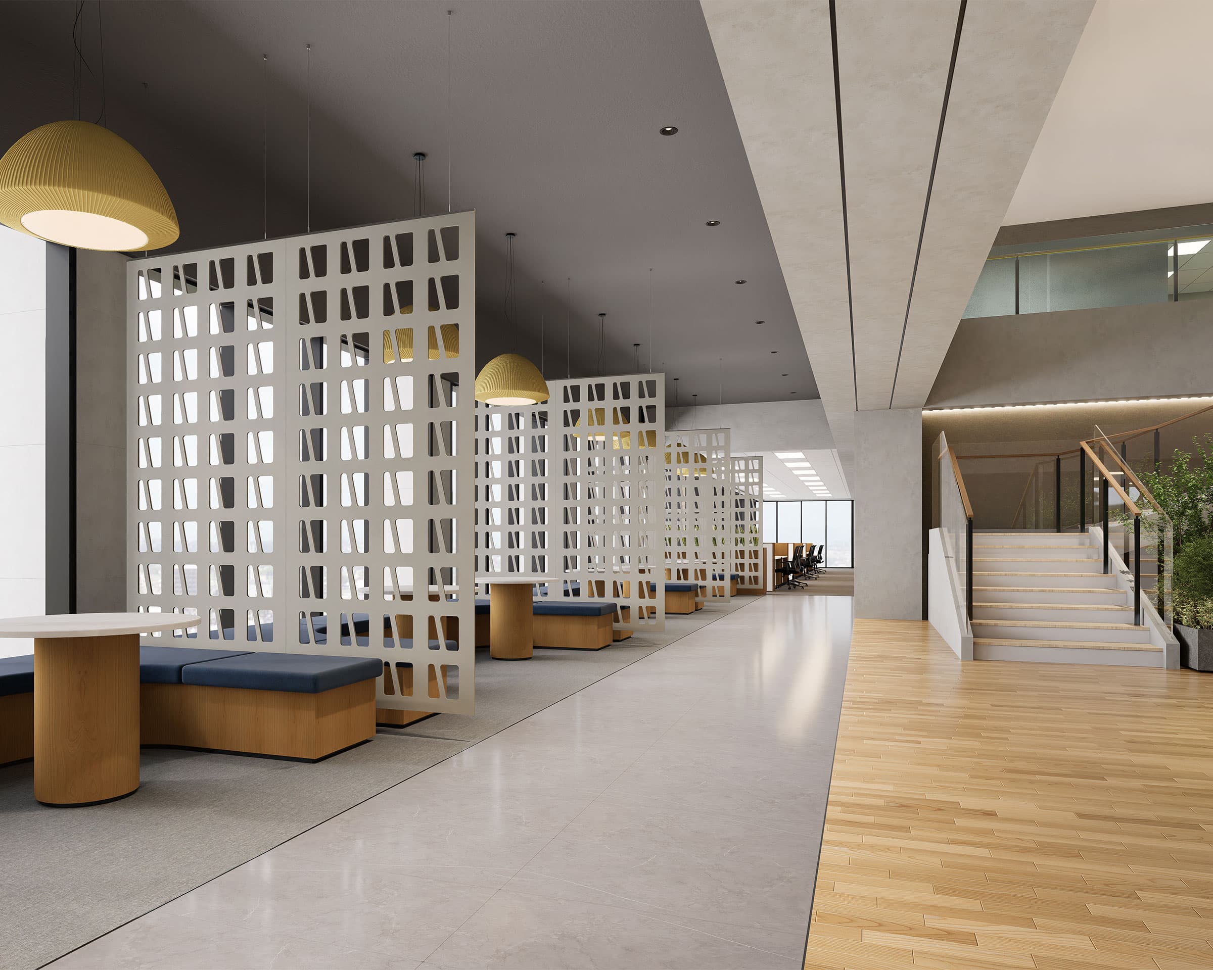 A spacious, modern office interior with an open seating area featuring white lattice acoustic felt screen partitions, blue cushioned bench seats, and wooden desks. The space is lit by large pendant lights. In the background, a staircase leads to an upper level with glass railings.