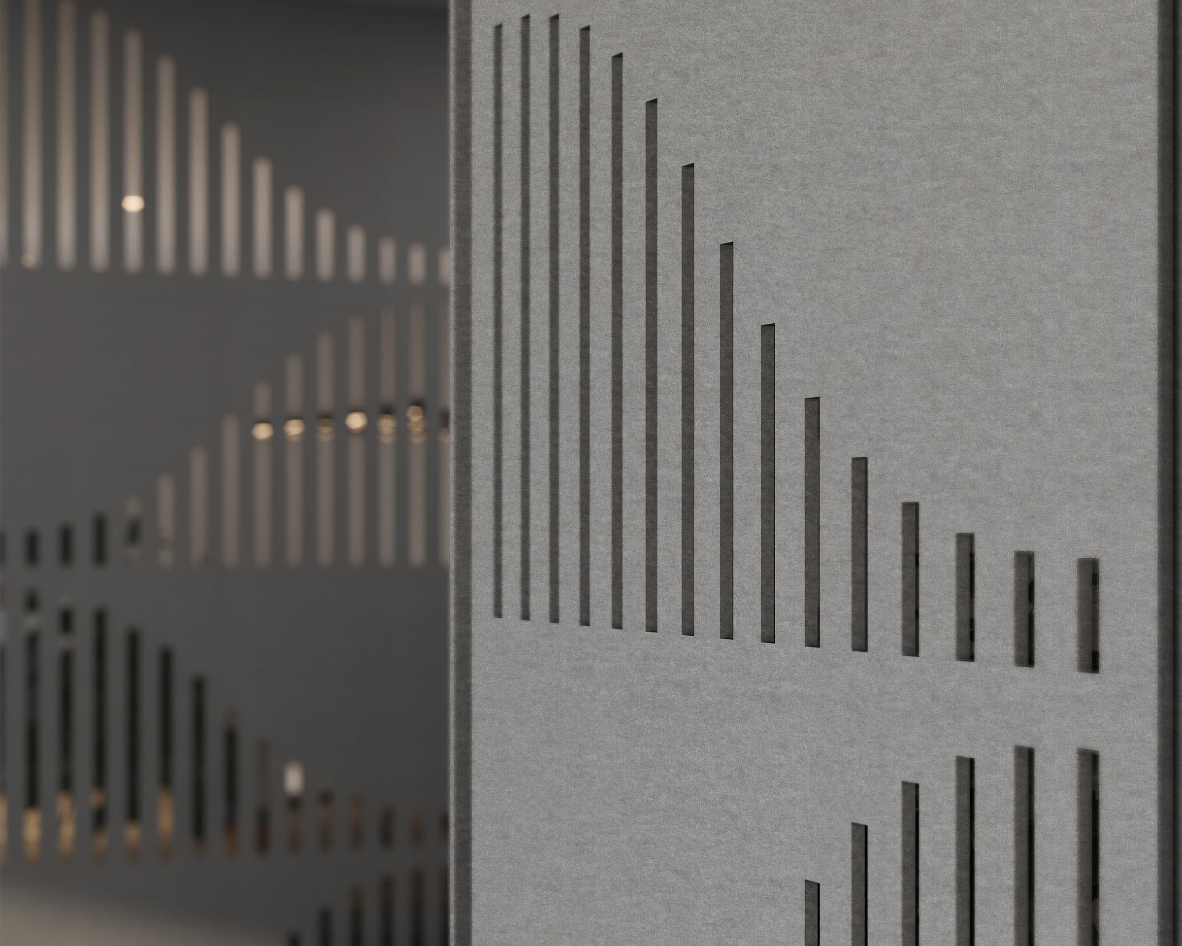 A close-up of a gray acoustic felt screen featuring vertical slits arranged in a geometric pattern. The wall design creates a modern, abstract visual effect.