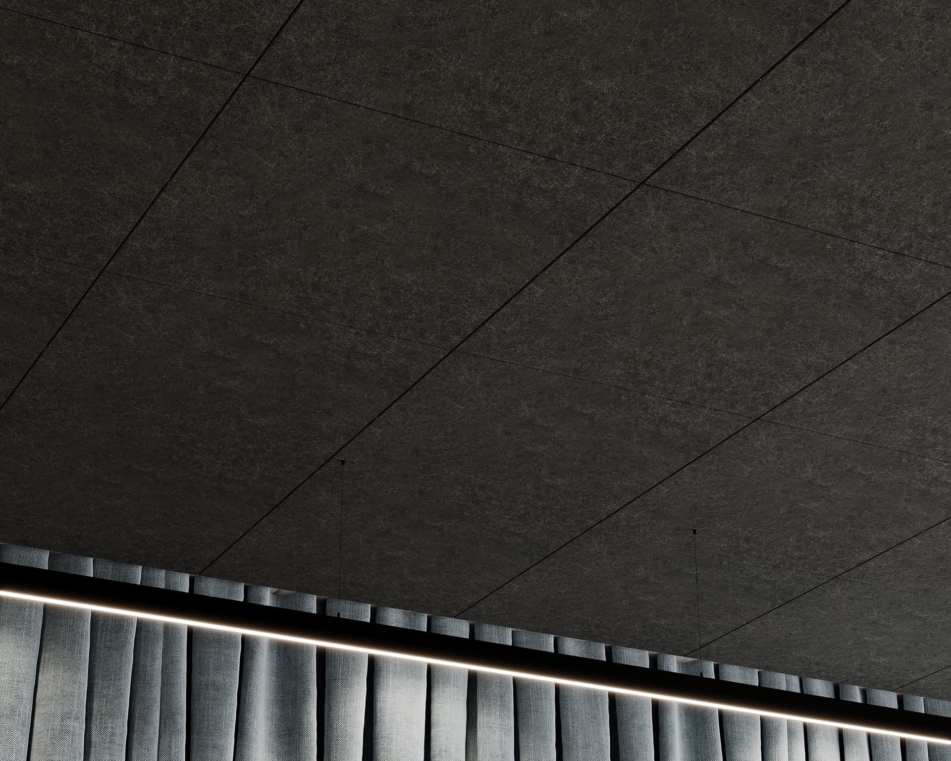 A close-up view of a modern, industrial-style ceiling with dark tiles. Below the ceiling, there are vertical grey metallic panels running horizontally, illuminated from behind by linear, warm white lighting.