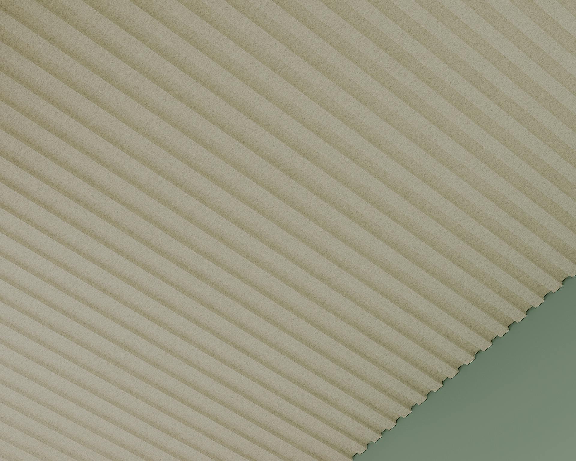 Diagonal view of a beige, acoustic ceiling frame intersecting with a green background. The pattern creates a contrasting texture between the smooth green area and the plateau ceiling frame.