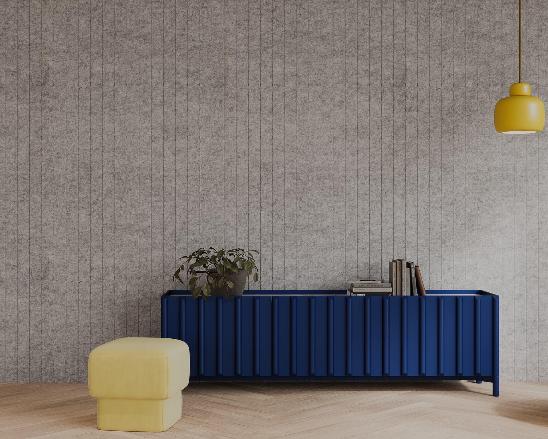 A minimalist interior with a gray, lined acoustic felt wall, a vibrant blue sideboard, and a few books and a potted plant on top. A yellow upholstered stool sits to the left, and a yellow pendant light hangs from the ceiling. The floor features a light wood herringbone pattern.