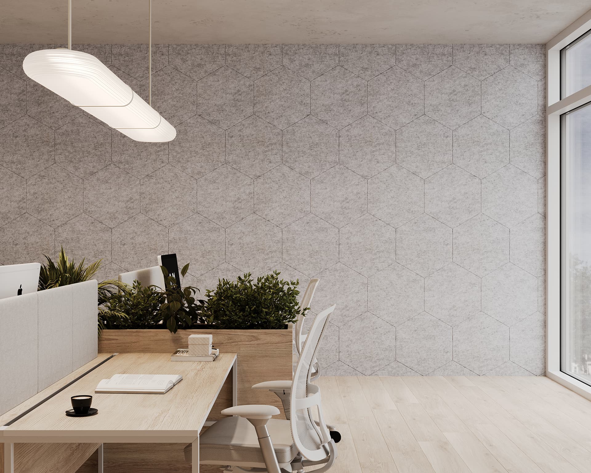 Modern office space with a large window on the right allowing natural light to fill the room. The office features a sleek, hanging light fixture, a textured hexagonal-patterned acoustic felt wall, and a desk with potted plants and two ergonomic chairs. A coffee cup is on the desk.