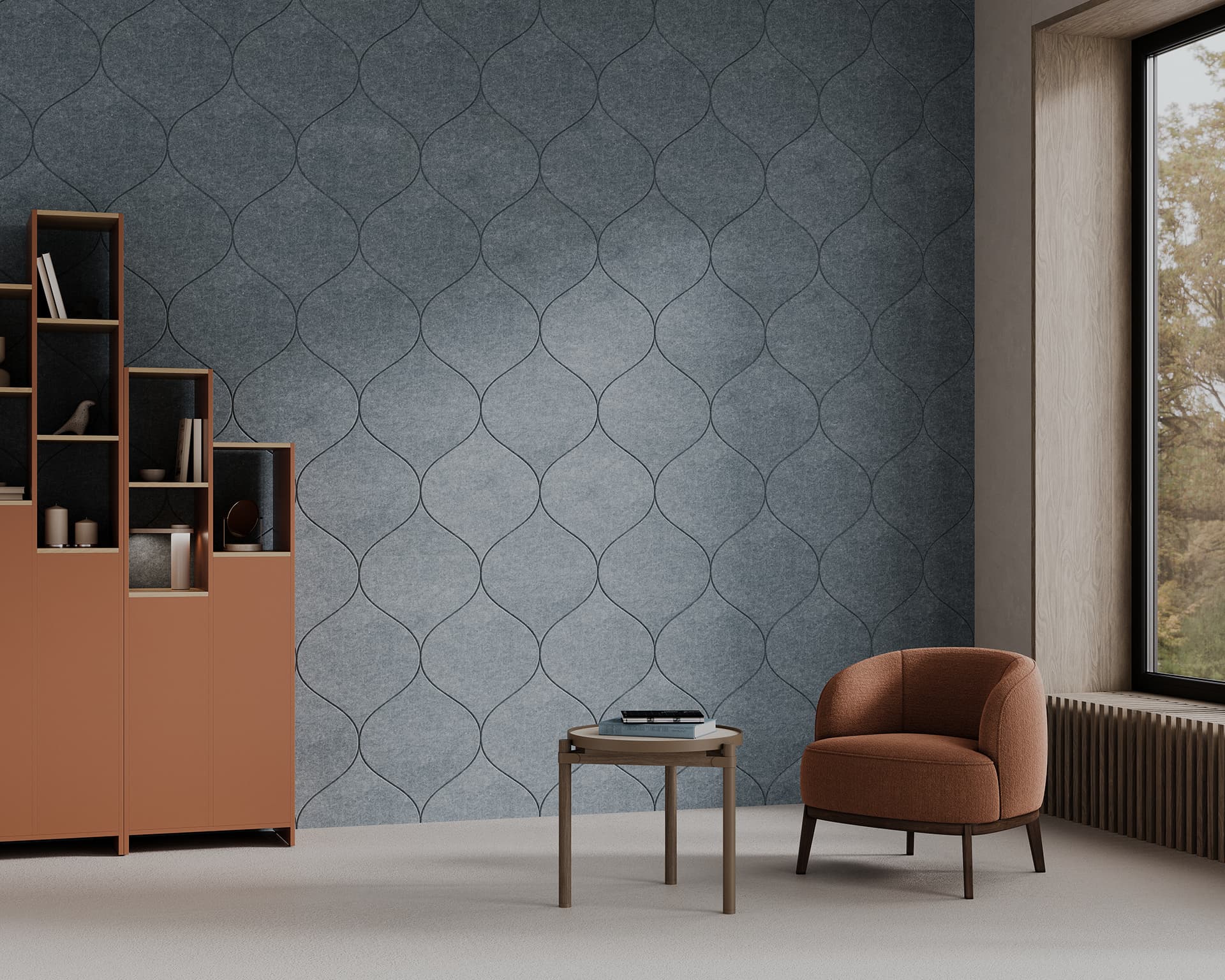 A modern living room features a geometric-patterned blue acoustic felt accent wall, a bold burnt orange shelving unit with assorted decorative items, a matching burnt orange armchair, and a small wooden side table with a book and eyeglasses. A large window offers a view of trees.