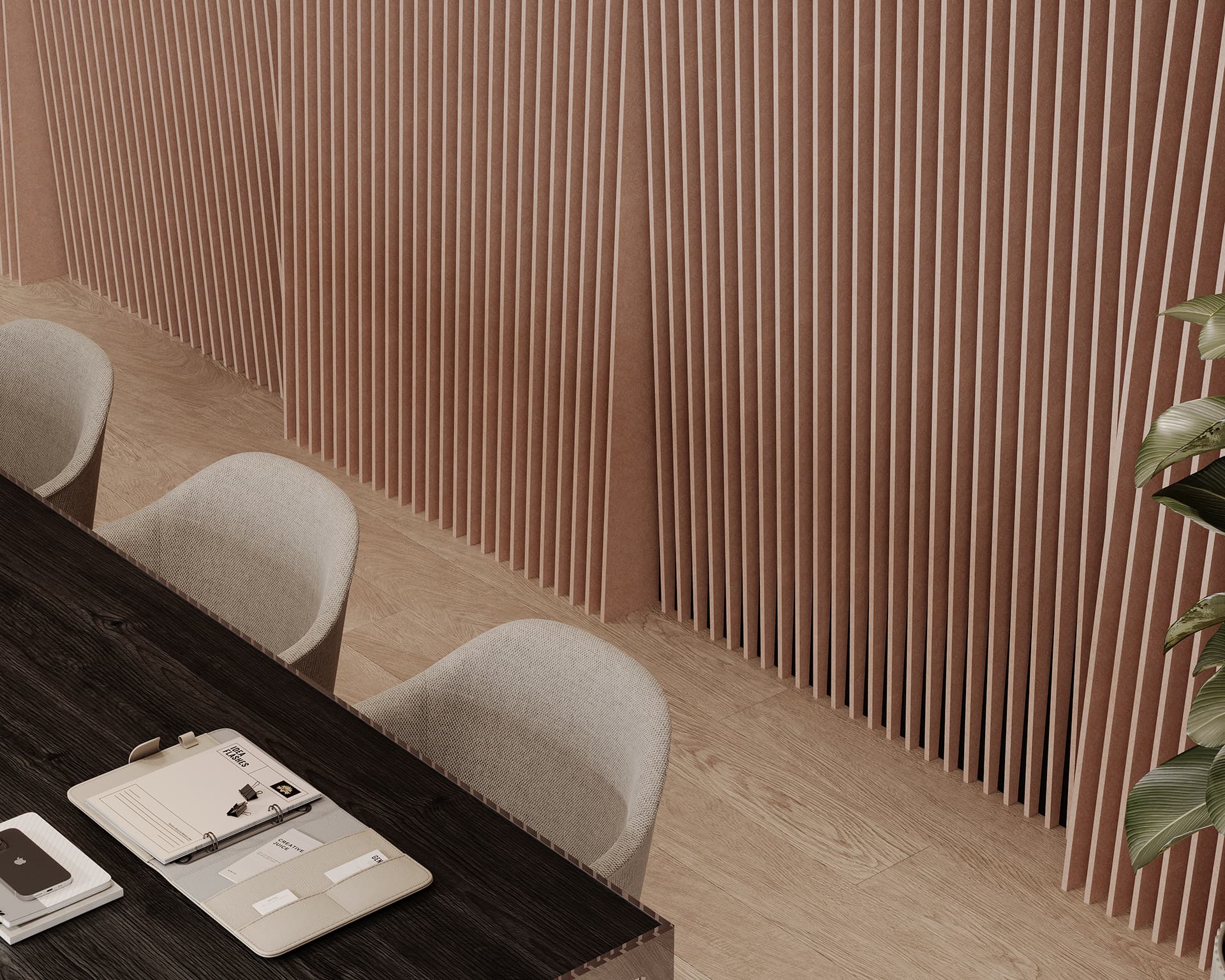 A modern office space with a dark wooden table and beige chairs. On the table are various office supplies, including notebooks, a tablet, and a pen. The background features vertical acoustic felt panels and a potted plant on the right side.