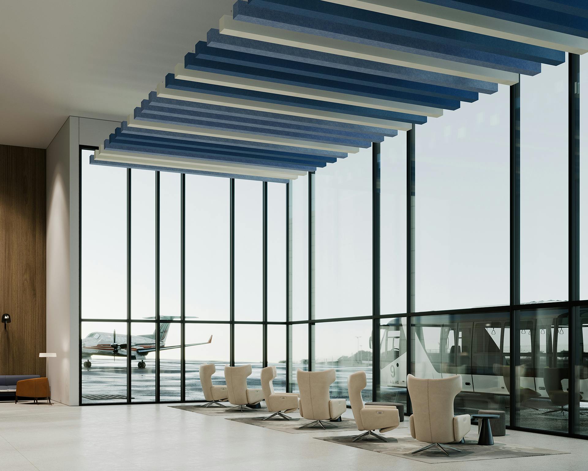 Modern airport lounge with floor-to-ceiling windows overlooking an airplane outside. The interior features comfortable armchairs and contemporary decor with blue and white acoustic felt ceiling baffles. Natural light fills the spacious area, creating a serene atmosphere.