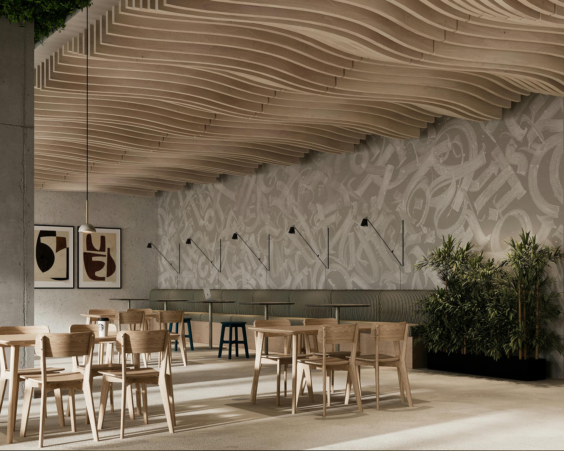 A modern cafe interior with wooden tables and chairs arranged neatly. The ceiling has unique billow acoustic felt ceiling baffles, enhancing both the design and sound quality. The back wall features abstract gray artwork, and there are several plants along the right side, adding greenery to the space.