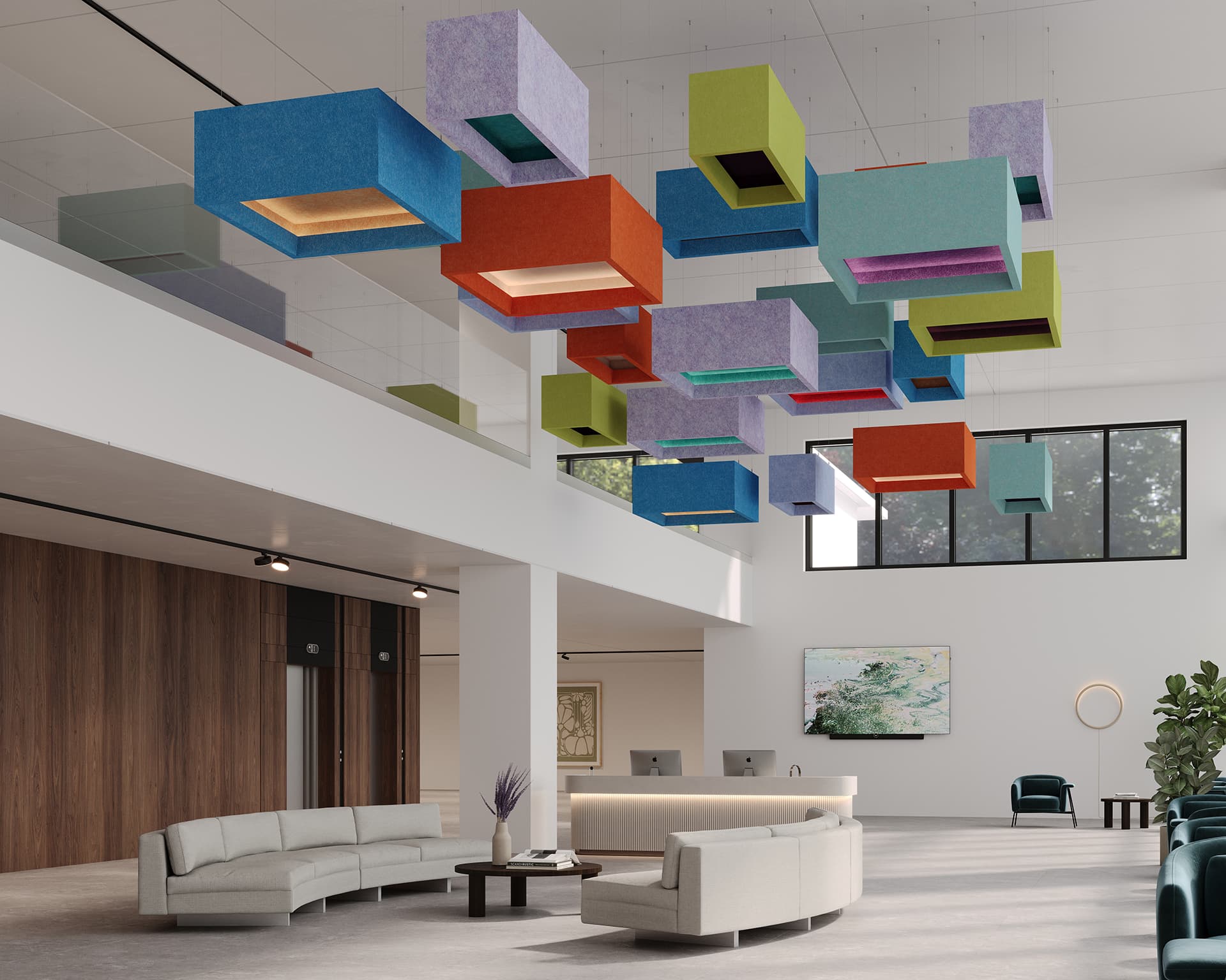 A modern office lobby features a double-height ceiling with colorful, cube-shaped acoustic felt clouds hanging from above. The space includes curved sofas, a round coffee table, a reception desk adorned with plants, and large windows allowing natural light to stream in.